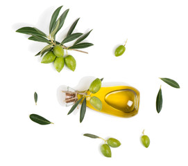 Olives with leaves and olive oil, above view.
