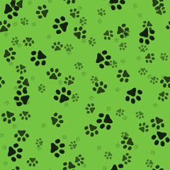 Animal paws. Random sized footprints. Seamless pattern. Vector illustration. Green