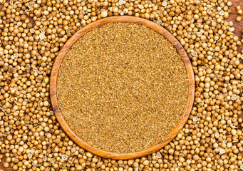  coriander seeds and wood plate