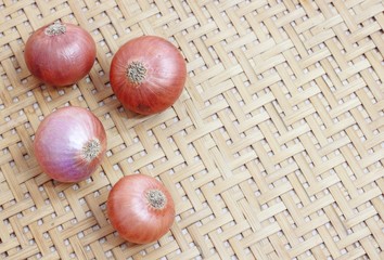 red onions on rustic wood