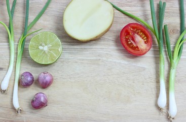 Green onion. Vegetarian food on wood