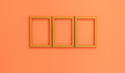wooden frame on orange vintage wall