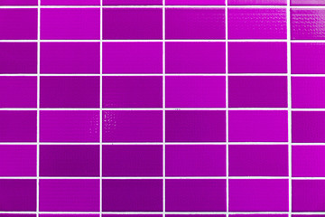 A purple tiled background with relatively small tiles