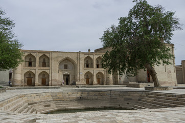 Pond on the square in front of medressa. Bukhara, Uzbekistan
