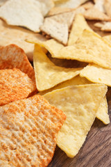 Heap of salted crisps and cookies, concept of unhealthy food