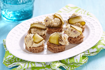 Canapes with fish pate and pickle