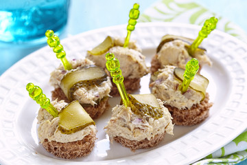 Canapes with fish pate and pickle