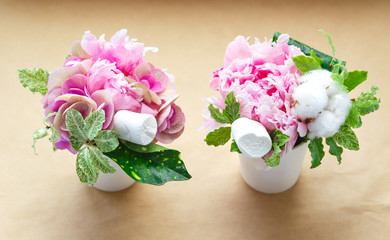 bouquets of peonies in a small vase