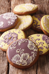 Round gingerbread cookies with icing flower close-up. vertical
