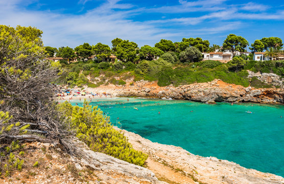 Summer holiday at Spain Majorca bay beach of Cala Anguila