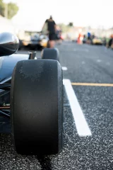 Fotobehang Black slick motor sport car tire close up © fabioderby