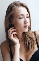 Fototapeta premium Beautiful and young girl woke up in the morning