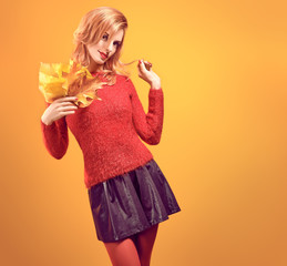Fall Fashion. Model Woman in Autumn Fashion Outfit. Playful Beauty Redhead girl in Stylish fashion...