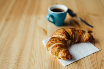 Breakfast with coffee and croissant