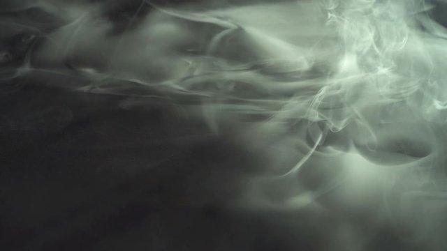 5 in 1! The stream of thick smoke on a dark background. Slow motion capture