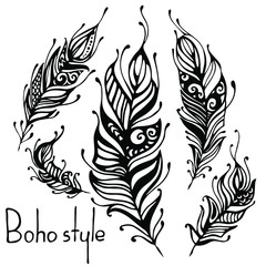 Hand drawn feathers. ink vector illustration. boho style design elements. ethnic creative doodles. isolated on white background