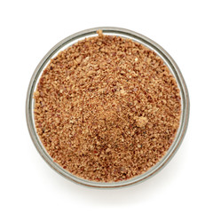 Organic powder of Indian Jujube (Ziziphus mauritiana) in a glass bowl. Isolated on white background. Top view.