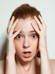 Emotional beauty portraits red-haired girl.