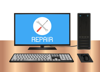 desktop computer with repair logo on screen