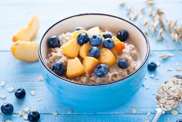Oatmeal with peach and blueberries.