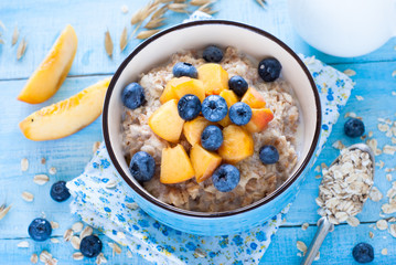 Oatmeal with peach and blueberries.