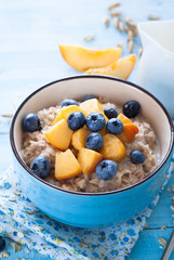 Oatmeal with peach and blueberries.