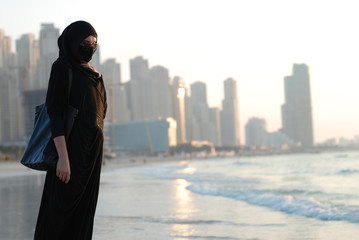 Arabic woman on the beach in Dubai