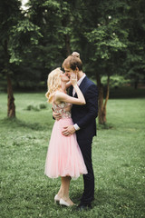 Fototapeta premium young couple in love having fun and enjoying the beautiful nature