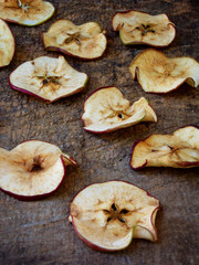 Wooden dried apples in the background. selective focus