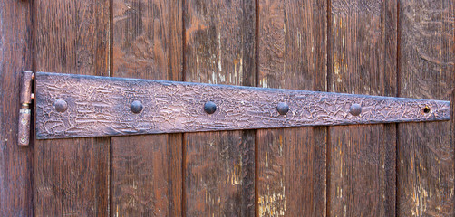 the metal part of the wooden door of the old church in Europe