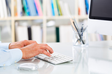 Businessman's Hands Typing on Keyboard