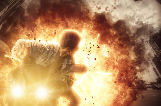 Woman on a motor bike on exploding background