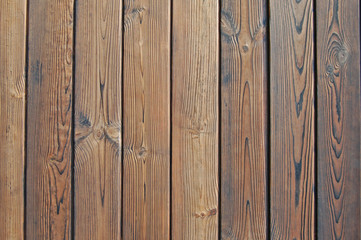 Naklejka premium Old wooden fence. wood palisade background.
