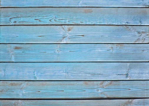 Old wooden fence. blue wood palisade background.