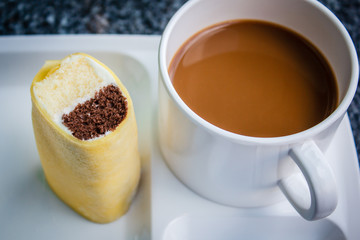 Coffee break with cake at business meeting.