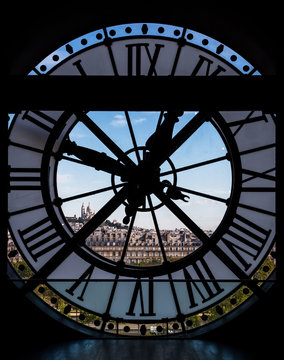 View through d'orsay museum clock tower of Sacre-Coeur Basilica.