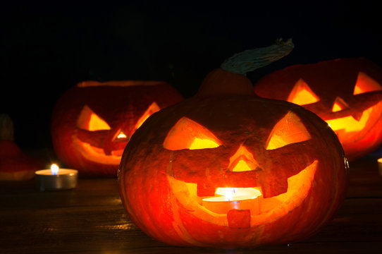 Scary halloween pumpkins on dark background