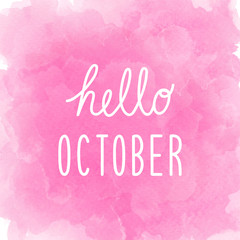 Hello October greeting on abstract pink watercolor background