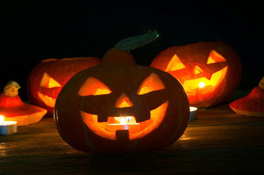 Scary halloween pumpkins on dark background