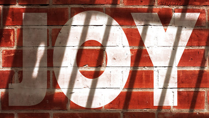 Joy Written On A Wall With Jail Bars Shadow
