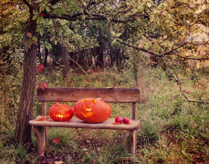 Halloween pumpkin on a wooden bench