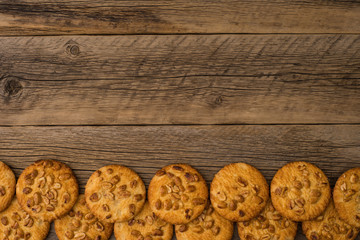 Cookies with peanut on old wooden table.