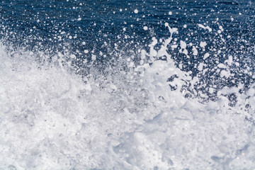 Deep blue sea surface with white waves foam, background, copy space