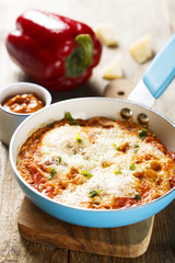 Omelette with cheese, bell pepper and tomatoes