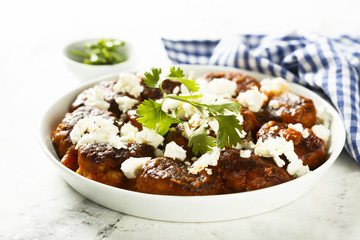 Meatballs in tomato sauce with feta cheese