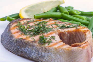 grilled salmon, lemon and beans closeup