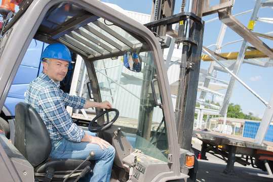 Portrait of forklift driver outdoors