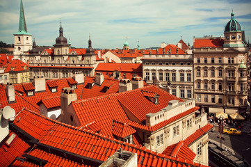 Fototapeta na wymiar Tiled roofs of ancient houses in the heart of historical city