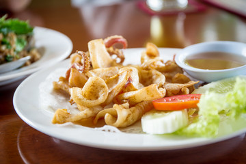 Fried squid with spicy sauce.