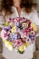 Bouquet of pink orchids, chrysanthemums and hortensias